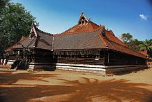 Most of Kerala buildings appear to have low height visually, due to over-sloping of roofs, which are meant to protect walls from rains and direct sunshine. Koothambalam at Kerala Kalamandalam.jpg