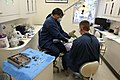 Lakita Jackson, a dental assistant, prepares a patient for an operation at the dental clinic on Marine Corps Recruit Depot Parris Island, S.C 130124-M-EK666-003.jpg