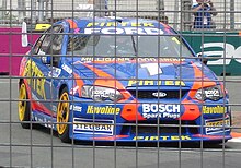 Stone Brothers Racing Ford Falcon BA on the Surfers Paradise Street Circuit in October 2005 Marcos Ambrose in Supercar at Surfers Paradise.jpg