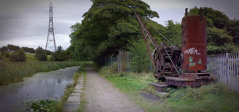 Derelict Smith (Rodley) crane, on the Manchester Bolton & Bury Canal Mbb canal steam crane sion.jpg