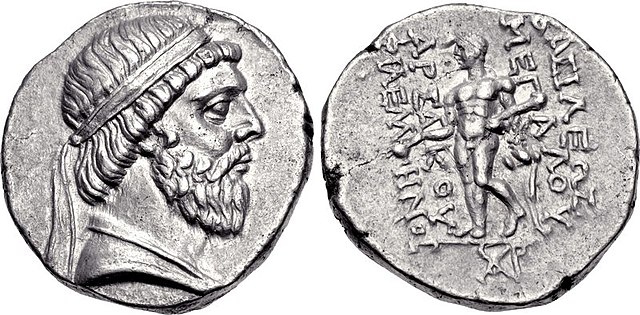 Drachma of Mithridates I, showing him wearing a beard and a royal diadem on his head. Reverse side: Heracles/Verethragna, holding a club in his left h