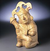 Moche ceramic vessel showing a warrior wearing headgear (Peru). MocheHeadgear.jpg