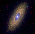 Mid-infrared view, combining the 3.6, 8.0 and 24 µm bands of the Spitzer Space Telescope