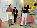 Estonian Artist Nerva presenting his painting on the art performance "Wet Paint!" in 2005