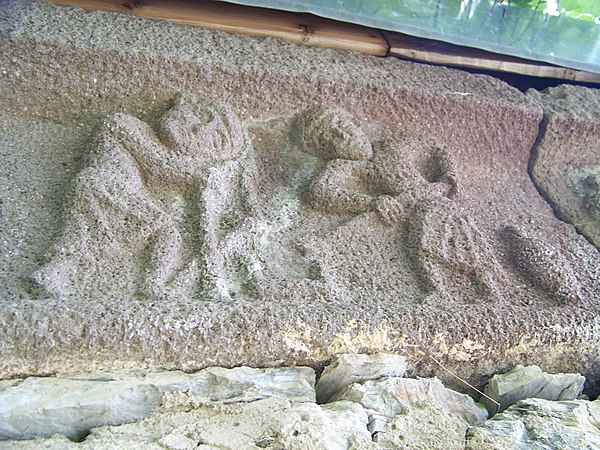 Workers prepare mortar in a trough. A 10th-century sculpture from the Korogho church, Georgia.