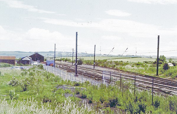 The site of the first Reston station, photographed in 1997. The later site of the current station is obscured by the building in the background.