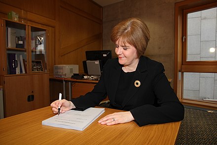 Sturgeon signing the Scottish Independence Referendum Bill, 2013