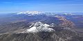 The sandstone reefs of Red Rock are seen to bridge the northern and southern parts of the Spring Mountains, in this aerial view from the south