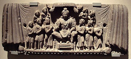 The bodhisattva Maitreya and disciples, a central figure in Yogacara origin myth. Gandhara, 3rd century CE.