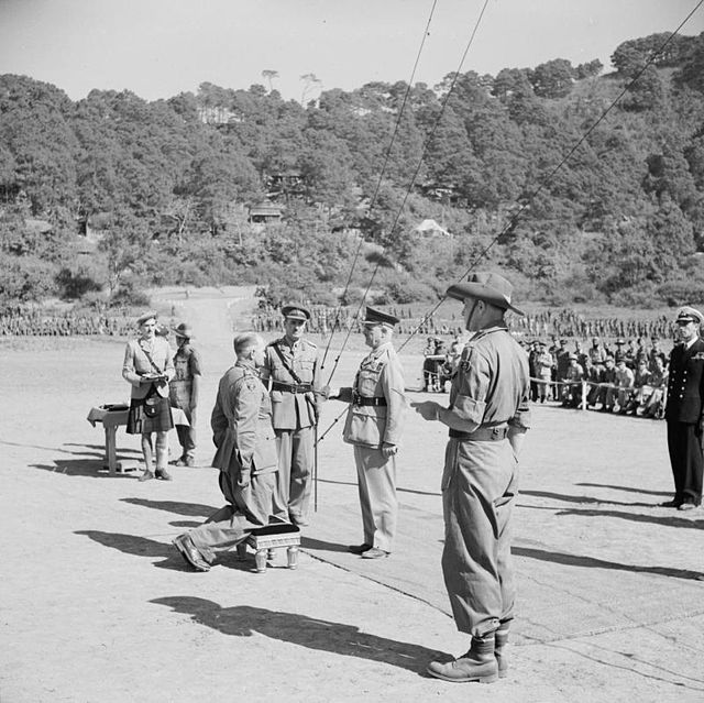 Lieutenant General Sir William Slim being knighted by the Viceroy of India, Field Marshal the Viscount Wavell, near Imphal, December 1944.