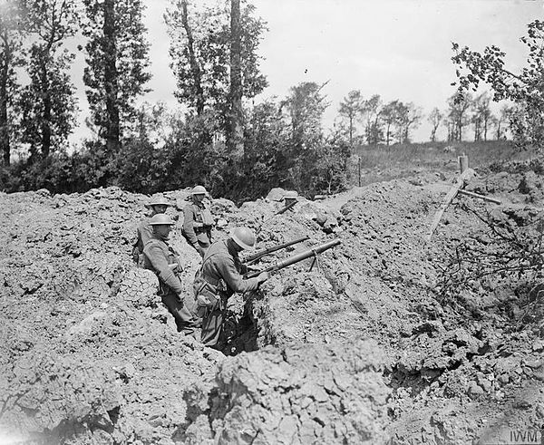 Men of the 12th (Service) Battalion, Royal Scots manning the lip of a mine crater at Meteren, 23 June 1918.