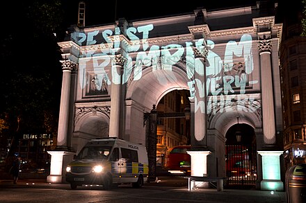 Activist group SumOfUs's Projection of "Resist Trumpism Everywhere" on London's Marble Arch as part of protests during Trump's July 2018 visit