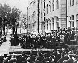 Albert A. Michelson, Professor of Physics and first American Nobel laureate, delivers the second Convocation Address in front of Goodspeed and Gates-Blake Halls, with President William Rainey Harper, professors, and trustees in attendance, July 1, 1894. Uchicago convocation 1894.jpg