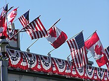 4th of July decorations in Roche Harbor include Canadian and U.S. flags and red, white and blue bunting. 2004 - 4th of July - Roche Harbor 019.jpg