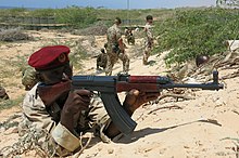 Instructors from the European Union Training Mission in Somalia (EUTM) take Somali soldiers through training drills at Jazeera Training Camp in Mogadishu. 2015 03 25 SNA PASSOUT-5 (16739095620).jpg