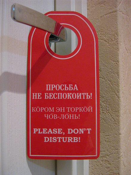 Trilingual (Russian, Komi, and English) sign in a hotel in Ukhta, Komi Republic