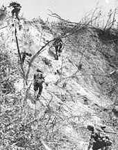 3/4 Marines assault uphill following airstrikes A187582.jpg