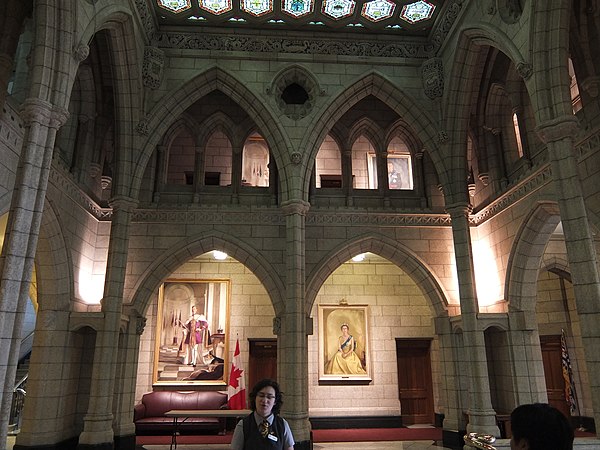 Portraits of King George VI and his daughter, Queen Elizabeth II, in the Senate foyer in the Centre Block of the federal Parliament