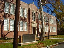 The former Edgar M. Gregory School, now the African American Library at the Gregory School AfrAmLibraryGregorySchoolBackentrance.JPG