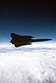 Air to air view right side view of a 9th Strategic Reconnaissance Wing's SR-71 Blackbird reconnaissance aircraft, flying over scattered clouds, on a mission out of Beale Air Force B - DPLA - 3ef1dd544180e087b06f894de4600ad7.jpeg