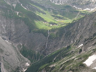 Typical valley step in a trough valley (Vilsalptal, Allgau Alps). In the foreground its U-shape is almost filled in; behind is a gentle ravine Baergacht-Wasserfall Alplsee.JPG