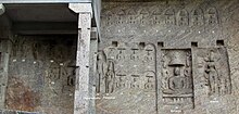 Jain bas-relief on the north side outer wall of the cave temple. Bas-relief at Chitharal Jain Monuments.jpg