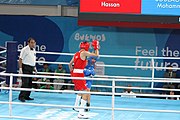 Deutsch: Boxen bei den Olympischen Jugendspielen 2018 Tag 12, 18. Oktober 2018 - Kampf um Bronze im Leichten Weltergewicht Jungen – Hassan Azim (Großbritannien, rot) schlägt Mohammed Boulaouja (Marokko, blau) RSC; Ringrichter ist Wulfren Olivares Peréz (Kolumbien). English: Boxing at the 2018 Summer Youth Olympics on 18 October 2018 – Bronze Medail Match Light Welterweight Boys - Hassan Azim (Great Britain, red) beats Mohammed Boulaouja (Morocco, blue) RSC; Referee is Wulfren Olivares Peréz (Columbia). Español: Boxeo en los Juegos Olímpicos Juveniles de Verano de 2018 en 18 de octubre de 2018 - Medalla de bronce de los hombres ligeros de peso welter: Hassan Azim (Gran Bretaña, rojo) vence a Mohammed Boulaouja (Marruecos, azul) RSC; El árbitro es Wulfren Olivares Peréz (Colombia).