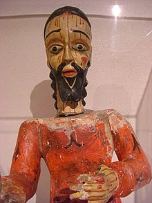 A Spanish colonial santo
or bulto
in a common style, with more caricature-like than realistic features; Harwood Museum, Taos, New Mexico Bulto, Harwood.jpg