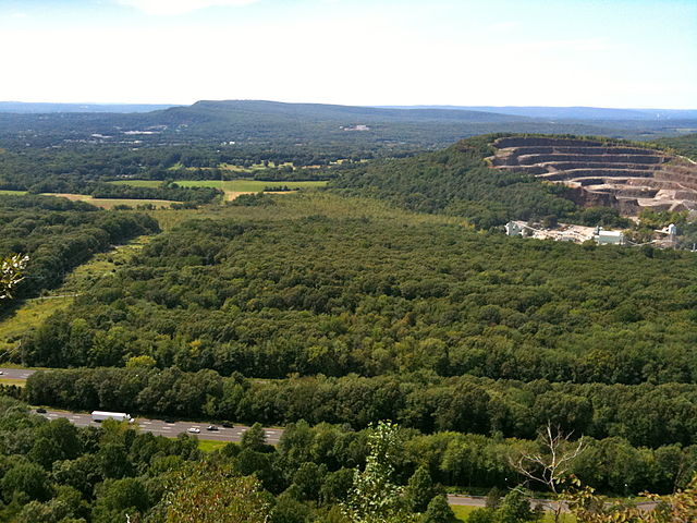 View from Higby Mountain of Interstate 91 and the eastern quarry face of Chauncey Peak. In the far distance is Lamentation Mountain's long ridge.