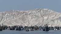 Fishing fleet in Ferrol Bay near Chimbote. In the middle of the 20th century, its port became the one with the largest fishing production on the planet. Chimbote 02.jpg