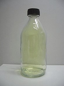 A glass container filled with chlorine gas