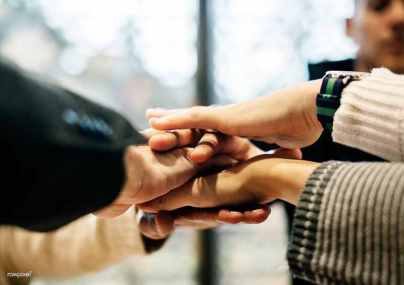 File:Diverse people stacking hands together.jpg