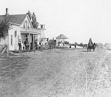 Main Street, Mona, Iowa, 1869. The building on the left is most likely a community-housing unit FI0002552.jpg