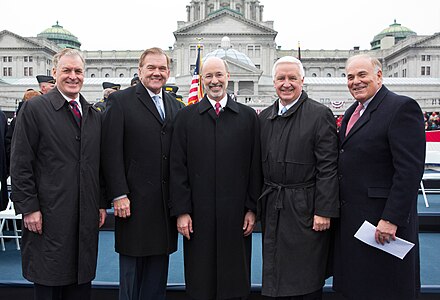 Five governors of the Commonwealth of Pennsylvania who have served since 1995, (left to right): Mark Schweiker, Tom Ridge, Tom Wolf, Tom Corbett and Ed Rendell (January 2015), pose in front of the south facade of the Pennsylvania State Capitol on the Susquehanna River front in Harrisburg at a gubernatorial inauguration Five PA-Governors.jpg