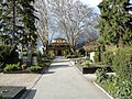 Cemetery with funeral hall, fountain, cemetery cross and memorials for the fallen