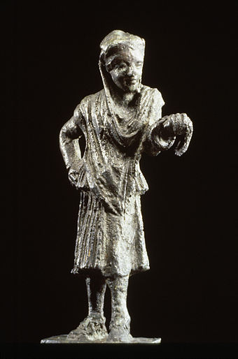 Bronze statue of a Greek actor, 150–100 BC. The half-mask over the eyes and nose identifies the figure as an actor. He wears a man's conical cap but female garments, following the Greek custom of men playing the roles of women. Later, slave women were brought in to play minor female characters and in comedy as well.