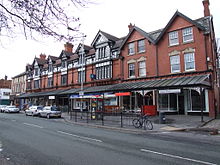 Shopping arcade, with wrought iron and glass canopy HeatonMoorRd4504.JPG