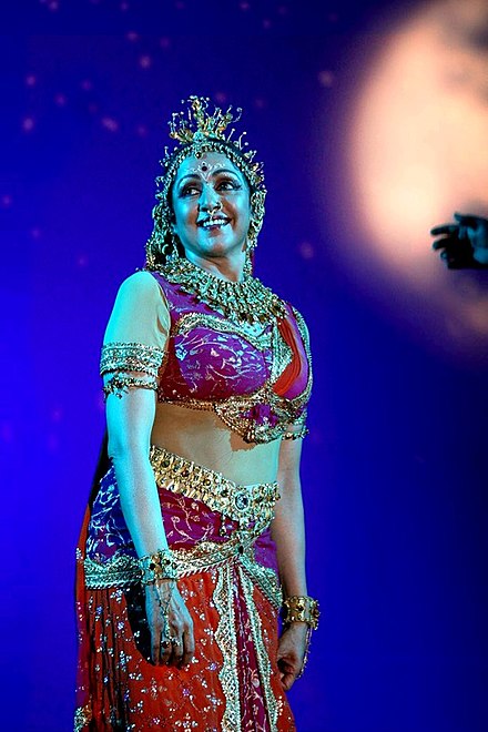 Malini performing at a concert in 2011
