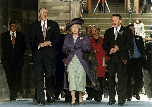 Queen Elizabeth II at the opening of the Scottish Parliament on 1 July 1999 alongside then First Minister of Scotland Donald Dewar and then Presiding 