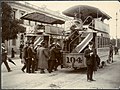 About 1909 : Outside the Government Offices in Wakefield Street, office workers board a tram after work. The other tram awaits Victoria Park race-goers.