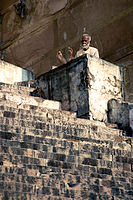 Holy man at the stairs by the Ganges Varanasi Benares India