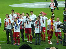 Spearing (furthest right) with his Liverpool clubmates after winning the 2012 Football League Cup final Liverpool players looking for family.jpg