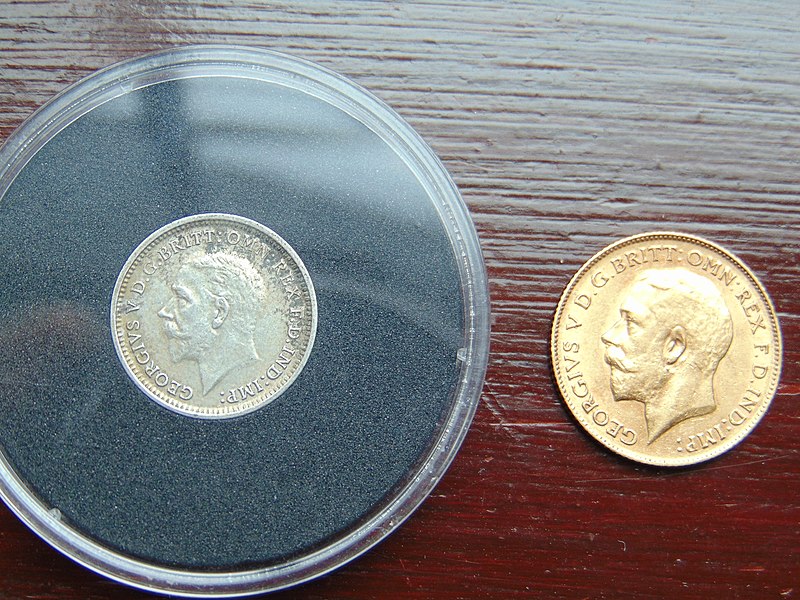 File:London Mint Office 1935 Threepence with 1911 Half Sovereign for scale.jpg