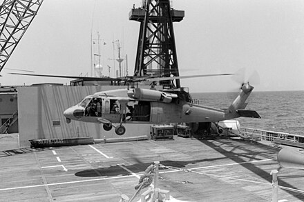 MH-60 landing on Hercules