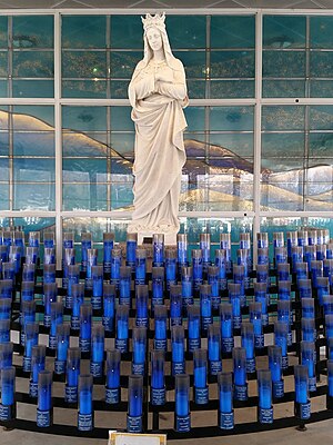 Mary Statue with candles in the Chapel of Light, Attleboro USA.jpg