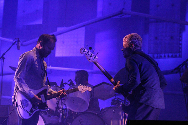 Godrich (left), Joey Waronker (rear) and Flea performing with Atoms for Peace in 2014