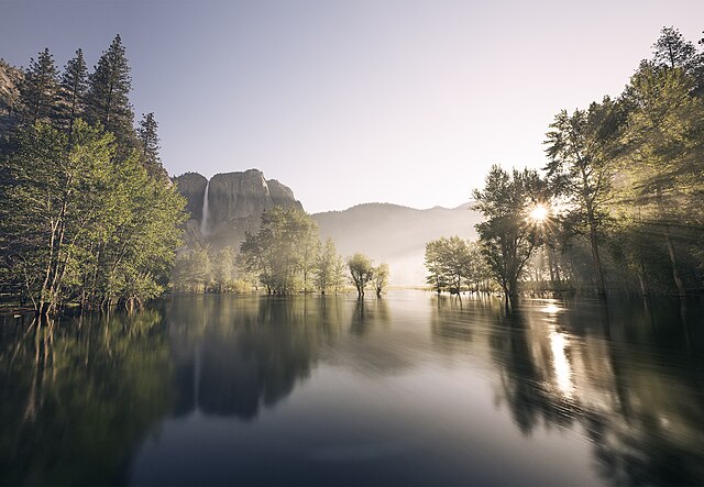 Sunrise over the Merced River as seen from Swinging Bridge in June 2023.