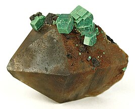 Crystals of metazeunerite perched on a complete smoky quartz crystal