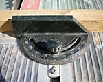 A table saw mitre gauge incorporates a fence.
