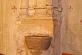 Font for Cagots in the Église Saint-Girons in Monein, with a small sculpture of what is presumed to be a Cagot.